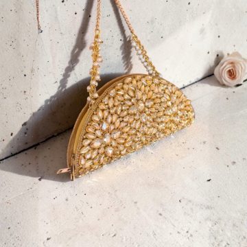 D shape Kundan clutch in gold